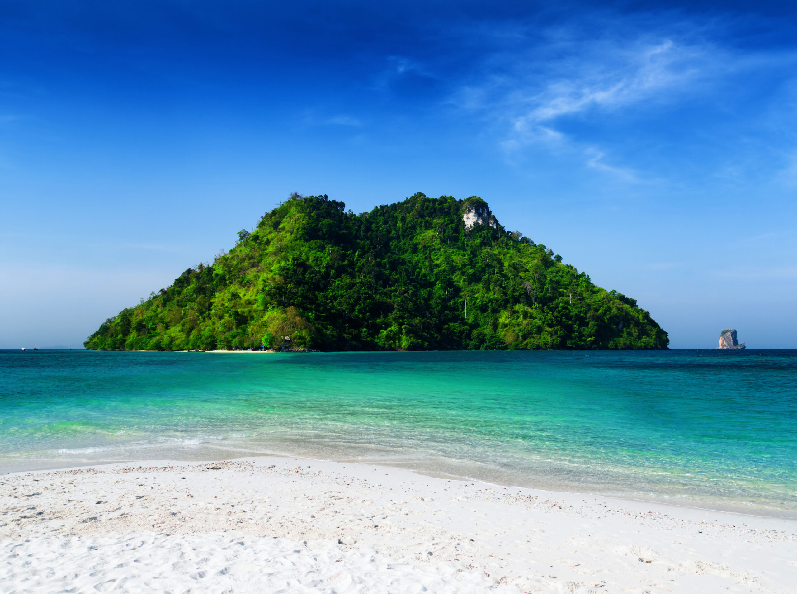 Clear water and blue sky. Beach in Krabi province, Thailand.